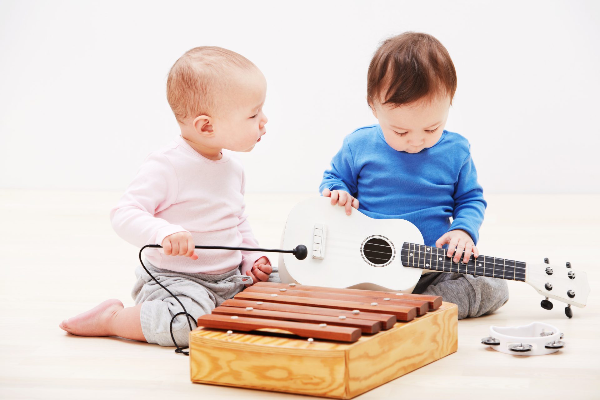 they have makings successful band shot two adorable babies playing with toy musical instruments