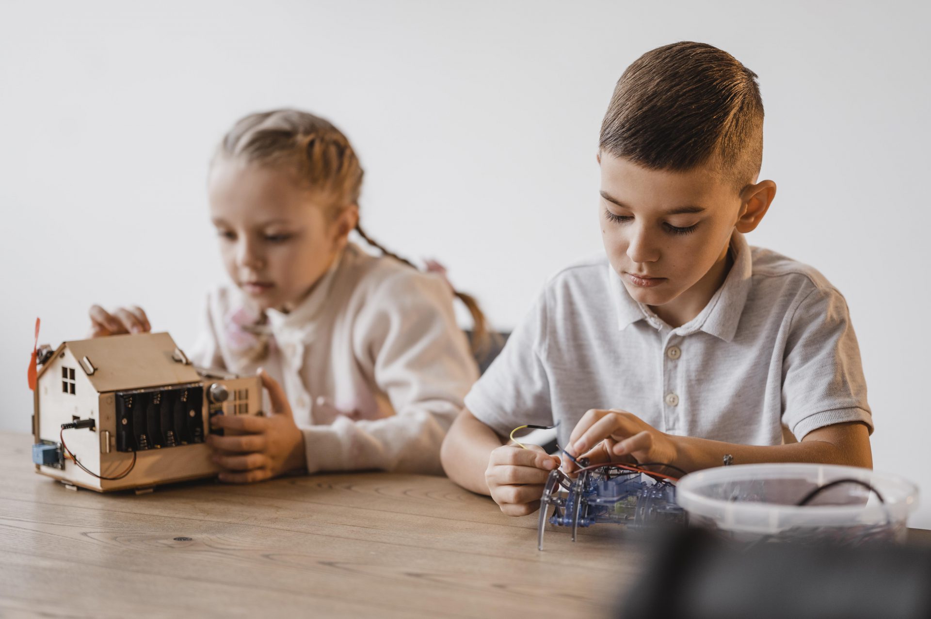 little girl boy learning about electrical devices